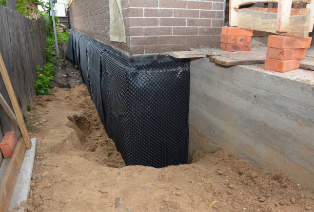 Happy homeowners after waterproofing job in Spring Valley